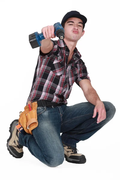 Trabajador joven con taladro — Foto de Stock