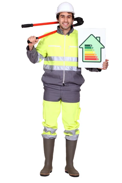 Εργάτης κρατάει πινακίδα βαθμολογία ενέργειας — Φωτογραφία Αρχείου