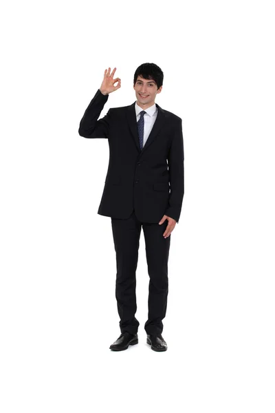 Happy businessman making OK gesture — Stock Photo, Image