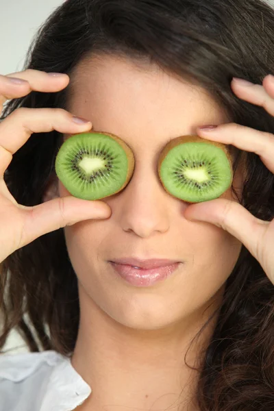 Woman with kiwi eyes — Stock Photo, Image