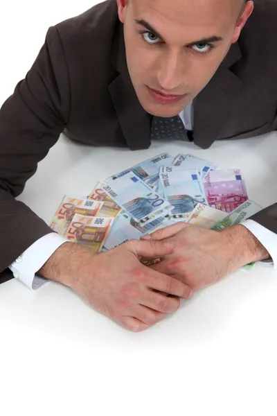 Cupid banker with threatening gaze — Stock Photo, Image