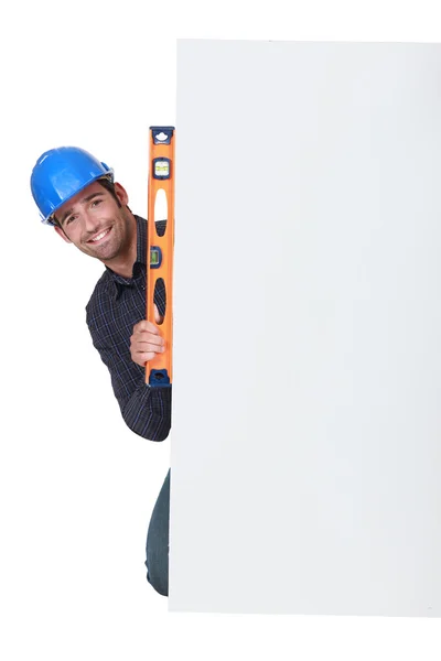 Workman with a spirit level — Stock Photo, Image