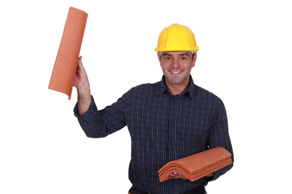 Builder holding roof tiles — Stock Photo, Image
