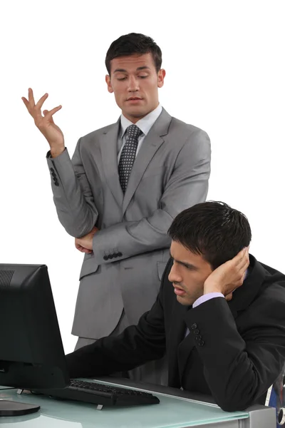 Arrogant businessman talking to his colleague — Stock Photo, Image