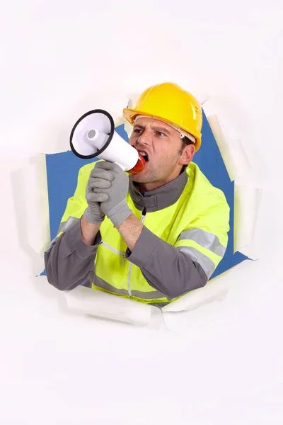 Construtor gritando em megafone — Fotografia de Stock