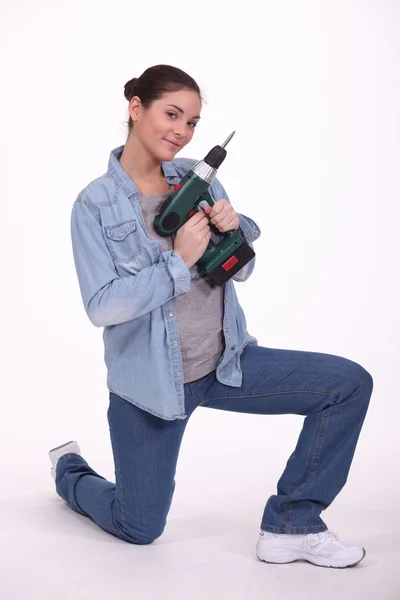 Woman with a cordless drill/screwdriver Royalty Free Stock Images