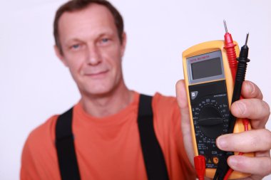 Electrician holding voltmeter clipart