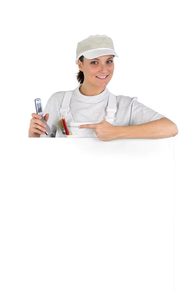 Woman painter showing telephone — Stock Photo, Image