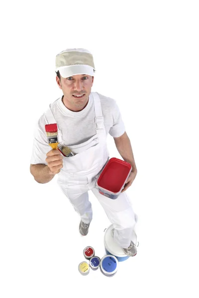 Decorator with a pot of red paint — Stock Photo, Image