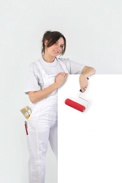 Painter holding a blank sign — Stock Photo, Image