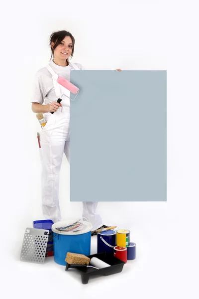 Decorador con un tablero en blanco para su mensaje — Foto de Stock