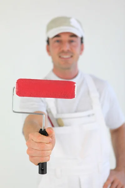 Decorator holding paint roller — Stock Photo, Image