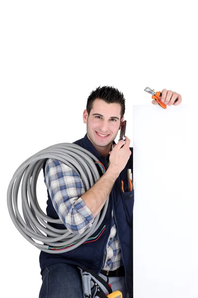 Electrician with blank panel — Stock Photo, Image
