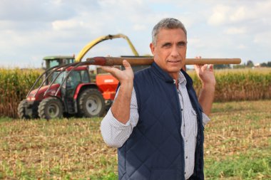 Farmer carrying a pitchfork clipart