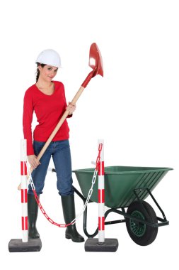 Labourer holding a spade clipart