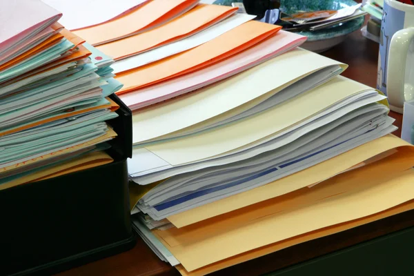 Paperwork piled on a desk — Stock Photo, Image