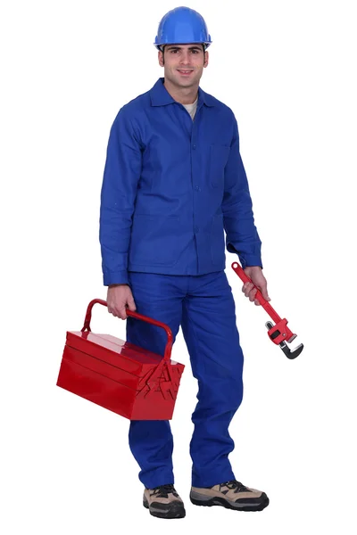 Homem com caixa de ferramentas e chave inglesa — Fotografia de Stock