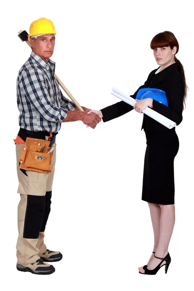 Construction workers handshaking — Stock Photo, Image