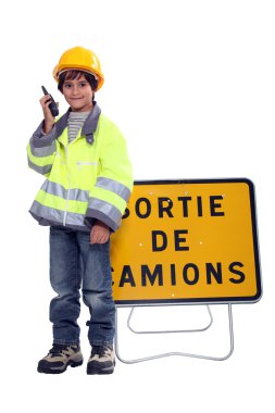 Young boy pretending to be a traffic guard clipart
