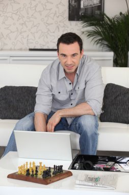 Man sat with laptop clipart