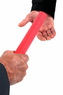 Businessman passing on a baton clipart