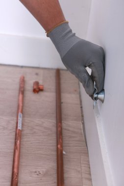 Plumber fitting copper pipes clipart