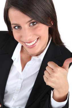 Woman in a suit giving the thumbs up clipart