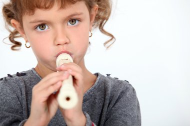 Little girl playing flute clipart