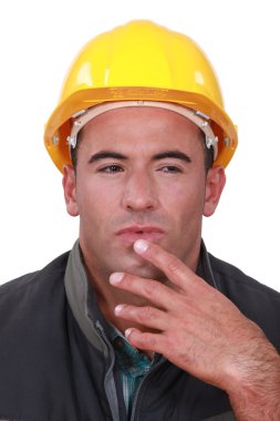 Portrait of a doubting tradesman clipart