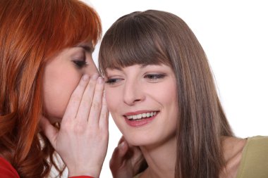 Two girls gossiping clipart