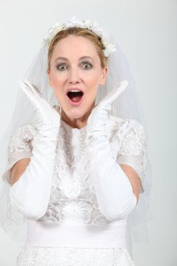 Blond woman dressed in wedding dress clipart