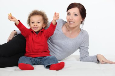 Woman spending time with her child clipart