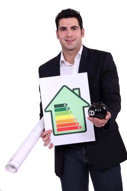 Man with energy rating sign and piggy bank clipart