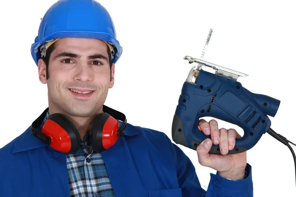 Builder with a jigsaw — Stock Photo, Image