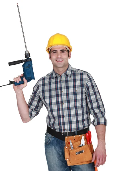 Man with a masonry drill — Stok fotoğraf