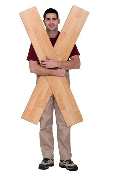 Carpenter with floorboards — Stok fotoğraf