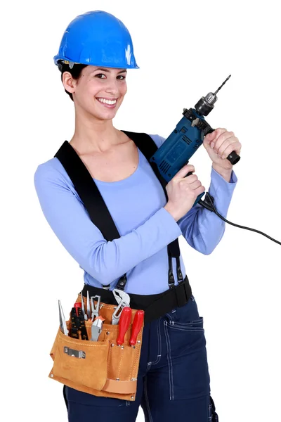 Donna con un trapano elettrico — Foto Stock