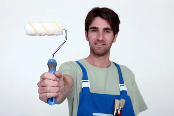 Man holding paint roller — Stock Photo, Image