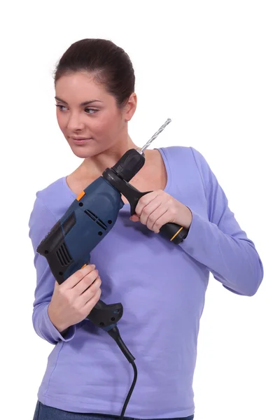 Kvinna anläggning drill — Stockfoto