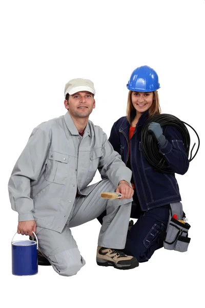 A female electrician and a male house painter — Stock Photo, Image