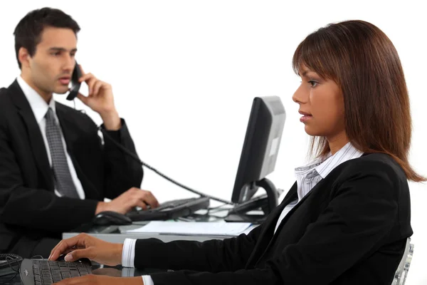 Two businesspeople hard at work — Stock Photo, Image