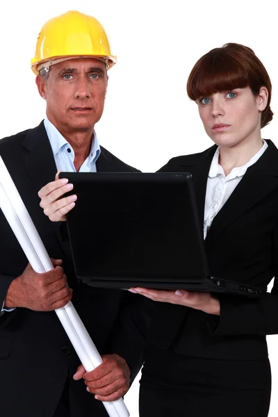 Architect couple with a laptop — Stock Photo, Image