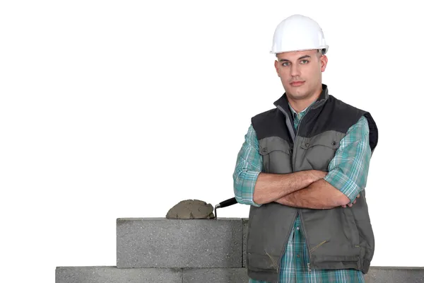 Tradesman standing by his work — Stock Photo, Image