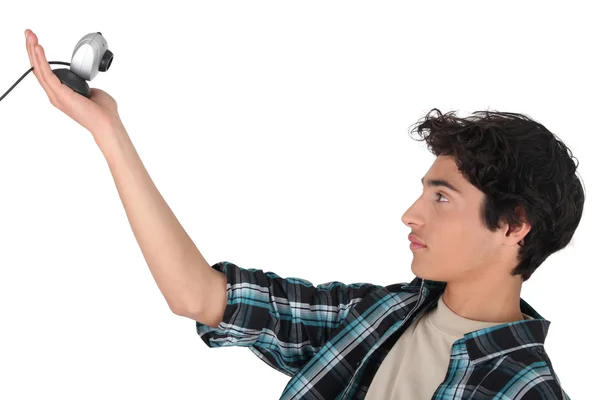 Tiener houdt van een webcam — Stockfoto