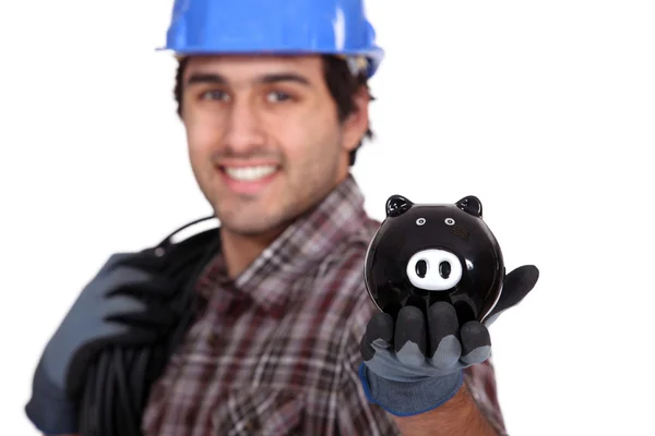 Elektricien met een piggy bank — Stockfoto