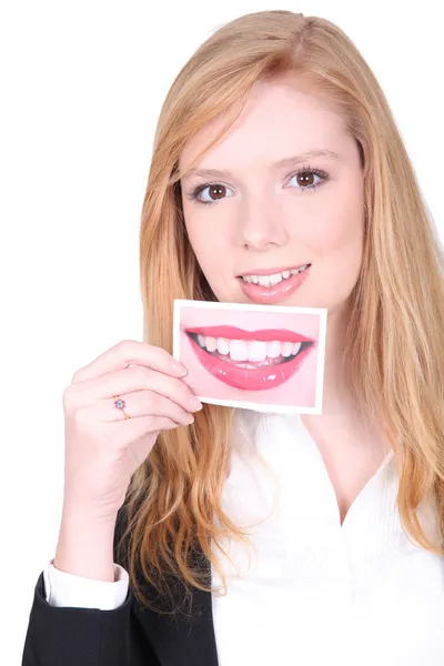 Mujer sosteniendo foto de la boca — Foto de Stock