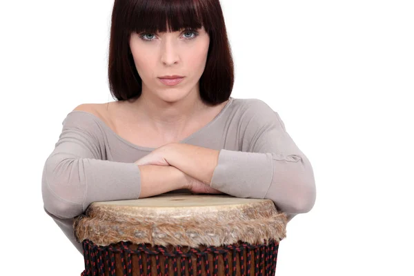 Woman leaning on a djembe — Stock Photo, Image