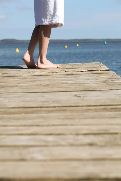 Stood on jetty looking out over water — Stock Photo, Image