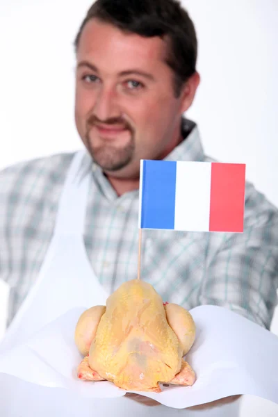 Человек с французской птицей — стоковое фото