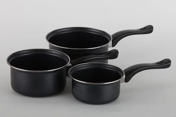 Set of three saucepans — Stock Photo, Image